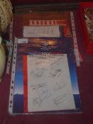 A Champion League final program from 2006 Arsenal V Barcelona together with two sets of autographs
