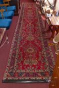 A fine North West Persian Tabriz runner, 455 x 91cm, repeating floral petal and vase motifs on a
