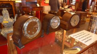 A collection of four c1930's mantel clocks including a Smith's example with heart form hand, and a