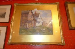A glazed and framed watercolour village scene signed E.M. Dyas
