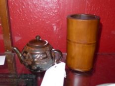 A Chinese buffalo horn carved teapot together with a bamboo brush pot