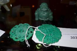 Two jade style pierced pendants and a similar Buddha figure