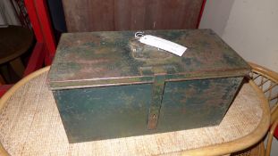 An old green painted metal tool box with fitted interior