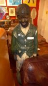 An early C20th painted plaster advertising figure