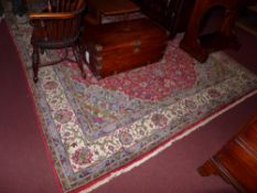 A Persian style rug the blue ground having all over floral decoration