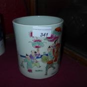 A Chinese brush pot decorated with social scenes