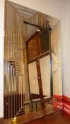 An Art Deco style wall mirror the rectangular plate within slatted bevelled multi border