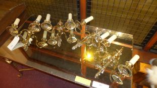 A set of four brass sconce wall lights