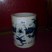 A Chinese blue and white brush pot decorated with dragons