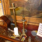 A large C19th English brass candlestick of faceted form together with a smaller Spanish brass