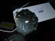A Chinese jade carving depicting two dragons