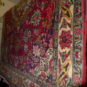 A fine North West Persian Tabriz rug, 195 x 140cm, central book cover design with repeating petal