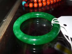 A Chinese green jade bangle