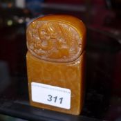 A Chinese soapstone seal with carved birds and dragon in relief