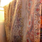 A Persian Bokhara rug the blue field decorated with flowers