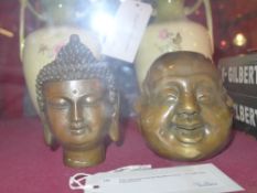 Two Chinese bronze Buddha heads, one with four expressions