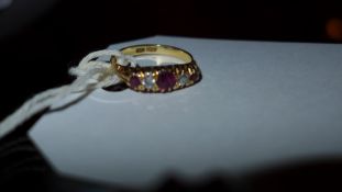 A 18ct gold ladies ring inset with ruby and diamonds