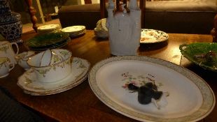 A miscellaneous collection including cabbage plates, dinner plates, Faience vase, Staffordshire