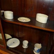 A pair of cream ware basket form dishes, pierced small dish, three drainer's, mugs and others