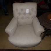 A pair of Howard design armchairs upholstered in grey button linen raised on turned supports W 90