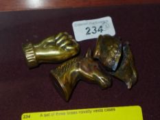 A set of three brass novelty vesta cases
