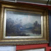 A C19th oil on canvas rural lakescape with ruins in the distance and figure in the fore indistinctly
