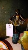 A bronzed ballerina on a marble stand