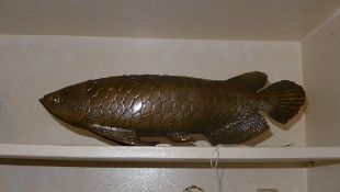 A bronzed figure of a carp