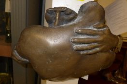 A modern bronzed sculpture ''The Embrace''