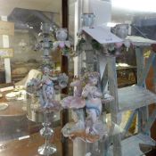 A pair of Meissen style candlesticks with cherub and maiden relief (a/f)