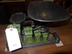 A set of cast iron vintage weighing scales and weights