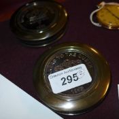 A pair of cased brass compasses