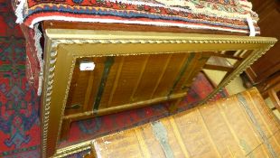 A C20th wall mirror the rectangular plate in gilded frame
