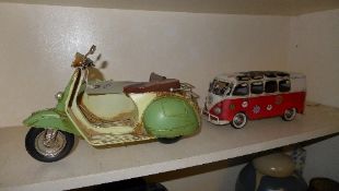 A wrought iron VW van and a scooter with sidecar