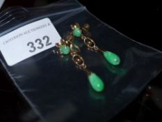 A pair of 14ct gold and green semi preci