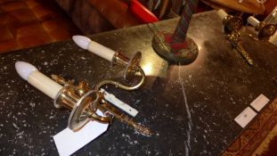 A pair of brass twin sconce wall lights