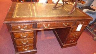A Victorian mahogany pedestal desk the t