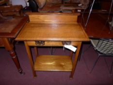An Arts and Crafts inlaid ash side table