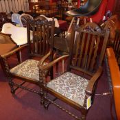 A pair of C19th carved oak elbow chairs