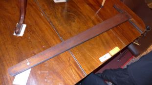 A vintage mahogany set square