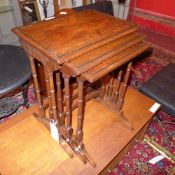 An inlaid mahogany nest of three tables