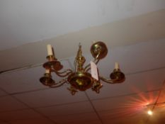 A brass six branch hanging chandelier