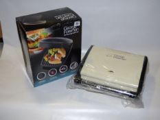 *2 George Foreman Grills ( 1 Boxed - 1 Used & Boxed)