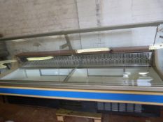 Deli Style Refrigerated Serve Over Counter with Simulated Granite Back and Curved Glass Front by