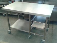 Mobile stainless steel table with tray storage, 1.2m long