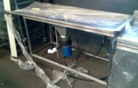 Dishwasher pass through table with waste disposal