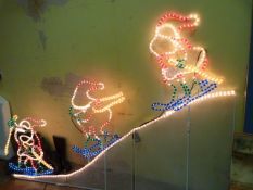 Illuminated Christmas Decoration - 3 Santa's Skiing