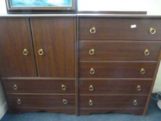 2 Mahogany Coloured Units comprising of 1 Set of 5 Drawers and 1 TV Cabinet with 2 Drawers with