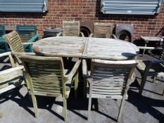 Jarva Teak Oval Extending Dining Table with 7 Stackable Chairs