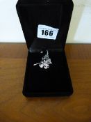 Ladies Silver Coloured Pendant of a Flower with a Pink Stone